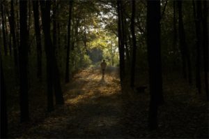 Woman walking towards light on "Depression Treatment" page