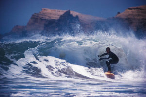 Male surfer riding wave